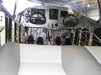 N4110K @ CNO - Cockpit area from seating area - by Helicopterfriend