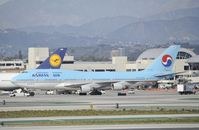 HL7491 @ KLAX - Getting towed to parking at LAX - by Todd Royer