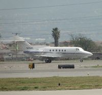 N26ME @ CNO - Rolling slowly down 26L and turned off runway and taxied back to hanger - by Helicopterfriend