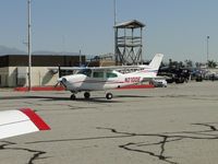 N210DE @ CNO - Taxiing past displayed aircraft - by Helicopterfriend