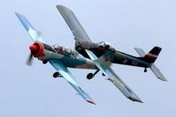 G-TYAK @ BREIGHTON - The Kraguj (G-BSXD) keeping close in the turn and the very gloomy conditions