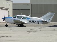 N4201B @ CNO - Parked near a hanger - by Helicopterfriend