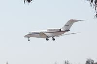 N990QS @ KAPF - Landing at Naples Municipal - by Bill Pahl