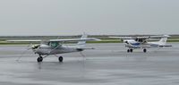 N4649M @ BKL - N4649M and N405SP seen on a rainy day at KBKL. - by aeroplanepics0112