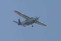 N782FE @ ONT - Coming out of the haze and turning down wind for runway 26 - by Helicopterfriend