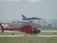 N39AU @ CNO - Lifting off from runway 26L while helicopter N98TE is landing on 26R - by Helicopterfriend