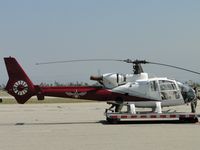 N686DT @ CNO - Walk around checking for FOD and/or obstructuions - by Helicopterfriend