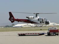 N686DT @ CNO - Lift off from towing dolly and headed westbound - by Helicopterfriend