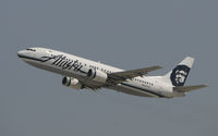 N767AS @ KLAX - Departing LAX on 25R - by Todd Royer