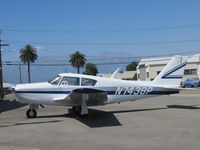 N7438P @ CNO - Parked by a hanger - by Helicopterfriend