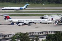 N908DL @ MCO - Delta MD-88