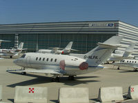 G-NLPA @ LOWW - Hangar 8 Hawker 750 - by Thomas Ranner