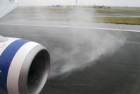 VH-VUI @ YMLT - A wet welcome to Launceston, Tasmania on board Boeing 737-8FE, February 2008 - by Malcolm Clarke