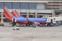 N281WN @ KPHX - Southwest Airlines Boeing 737-7H4 loading up for a trip at Gate D5 KPHX. - by Mark Kalfas