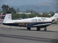 N48LW @ POC - Tied down, covered and parked in transient parking - by Helicopterfriend