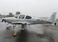 N935CT @ KAXN - Cirrus SR22 on the line on a rainy Sunday morning. - by Kreg Anderson
