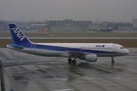 JA8387 @ RJGG - At a rainy afternoon on Nagoya Komaki Airport in November 2004