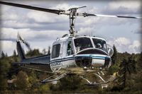 C-FRSR @ CYNJ - Returning after some practice in the field West of the airport - by Doug R. Matheson
