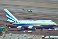 VQ-BMS @ KLAS - Las Vegas Sands Corporation Boeing 747SP-21 (ex N540PA & N149UA) on the ramp KLAS with Papillon Grand Canyon Helicopters Eurocopter - EC-130 B4 N894PA departing overhead. - by Mark Kalfas