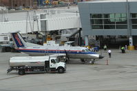 N561SW @ KLAS - SkyWest/United Express Embraer EMB-120, SKY5293 loading up at gate D59 for a trip to Palm Springs International Airport/KPSP. - by Mark Kalfas