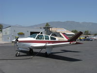 N5651K @ SZP - 1964 Beech S35 BONANZA, Continental IO-520-B 295 Hp, ruddervators cuff mod installed, refueling by SZP's new ghost service - by Doug Robertson