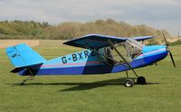 G-BXRZ @ EGHP - Has been in private hands since February 1998 - The dust in the background is caused by motor bikes scrambling, luckily, the wind was blowing in out favour.