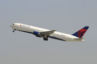 N129DL @ KLAX - Departing LAX on 25R - by Todd Royer