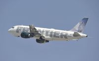 N940FR @ KLAX - Departing LAX on 25R - by Todd Royer