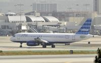 N641JB @ KLAX - Taxiing to gate at LAX - by Todd Royer