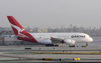 VH-OQI @ KLAX - Taxiing to gate at LAX - by Todd Royer