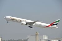 A6-EGI @ KLAX - Departing LAX on 25R - by Todd Royer