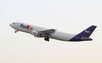 N688FE @ KLAX - Departing LAX on 25R - by Todd Royer