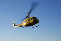 ZS-HHK - Huey arriving early morning on the soccer field of the Pietermaritzburg Correctional Centre. The work for the day was the lifting of 4×1300kg ventilation units - by Geoff O'Connell