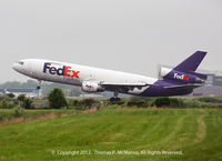 N571FE @ KPHL - FedEX 445 Heavy rotating on 27L departing a very overcast PHL.