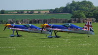 D-EYXA @ EGSU - 5. Paul Bonhomme leading the SBach Red Bull Duo prior to their scintillating display at IWM Duxford Jubilee Airshow, May 2012. - by Eric.Fishwick