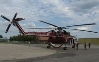 N718HT @ KAXN - Sikorsky CH-54 Skycrane refueling at the fuel pumps. - by Kreg Anderson