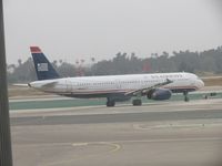 N520UW @ LAX - Taxiing onto runway 24L - by Helicopterfriend