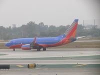 N791SW @ LAX - Taking off on 24L during an overcast day - by Helicopterfriend