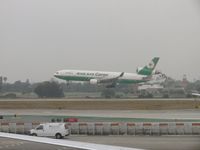 B-16111 @ LAX - Preparing to settle down on 24R - by Helicopterfriend