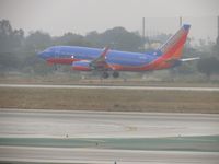 N417WN @ LAX - Ready to  touch down on runway 24R during a very overcast day - by Helicopterfriend