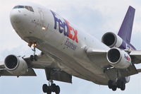 N569FE @ KORD - FedEx Mcdonnell Douglas MD-10-10F (ex American Airlines N133AA), FDX1605 arriving from Memphis Int'l /KMEM, RWY 28 approach KORD. - by Mark Kalfas