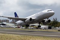 N407UA @ TNCM - N407UA