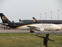 N163UP @ DFW - Parked at DFW.  You can see the statue of the boy which is located at the observation area at DFW.