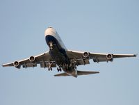 G-BNLI @ CYVR - Speedbird 747 passes the River Rock Hotel