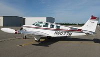 N8077M @ KDTL - Beech A36 Bonanza on the line. - by Kreg Anderson