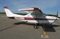 N52MM @ KDTL - Cessna 210M Centurion on the line. - by Kreg Anderson