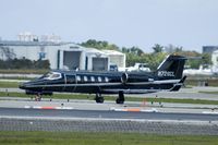 N728CL @ FXE - A black Learjet taxiing to Runway 8 @ Ft. Lauderdale Executive Airport - by Bruce H. Solov