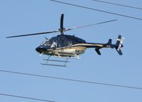 N407PS @ CLT - While walking along the greenway, this bird flew over at very low altitude.  At first, I thought it was the police looking for the squatters who have been living on the bridge over the creek. - by John Scherr
