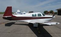 N2672W @ KAXN - Mooney M20C on the line. - by Kreg Anderson