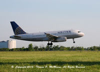 N807UA @ KPHL - United A-319 touching down on 9R for a early morning arrival at PHL.